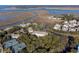 Aerial view of waterfront community, tennis courts, and lush landscaping at 2014 Long Bend Dr, Seabrook Island, SC 29455