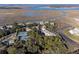 Aerial view of waterfront community, tennis courts, and lush landscaping at 2014 Long Bend Dr, Seabrook Island, SC 29455