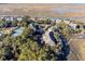 Aerial view of community, tennis courts, water access, and lush landscaping at 2014 Long Bend Dr, Seabrook Island, SC 29455