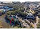 Aerial view of property near water, tennis courts, and other homes at 2014 Long Bend Dr, Seabrook Island, SC 29455