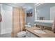 Clean bathroom with a shower/tub combo and granite countertop at 2014 Long Bend Dr, Seabrook Island, SC 29455