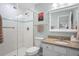 Clean bathroom with walk-in shower and granite vanity at 2014 Long Bend Dr, Seabrook Island, SC 29455