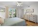 Bedroom with private balcony access and dresser at 2014 Long Bend Dr, Seabrook Island, SC 29455