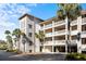 Lowcountry style building with balconies and palm trees at 2014 Long Bend Dr, Seabrook Island, SC 29455