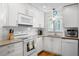 Modern white kitchen with granite countertops and stainless steel appliances at 2014 Long Bend Dr, Seabrook Island, SC 29455