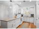 Modern white kitchen with granite countertops and stainless steel appliances at 2014 Long Bend Dr, Seabrook Island, SC 29455