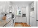 Modern white kitchen with granite countertops and stainless steel appliances at 2014 Long Bend Dr, Seabrook Island, SC 29455