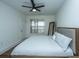 Main bedroom with king-size bed, ceiling fan, and large window at 2244 Ashley Crossing Dr # 333, Charleston, SC 29414