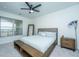 Bedroom features king-size bed, ceiling fan, and wood nightstand at 2244 Ashley Crossing Dr # 333, Charleston, SC 29414