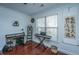 Bright home office with a large window, desk, and keyboard at 2244 Ashley Crossing Dr # 333, Charleston, SC 29414