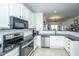 Modern kitchen with white cabinets and granite at 2244 Ashley Crossing Dr # 333, Charleston, SC 29414