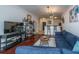 Open living room with sectional sofa and view into kitchen at 2244 Ashley Crossing Dr # 333, Charleston, SC 29414