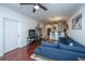 Open living room showcasing hardwood floors, sectional sofa, and kitchen bar at 2244 Ashley Crossing Dr # 333, Charleston, SC 29414