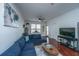Living room features hardwood floors, sectional sofa, and flat-screen TV at 2244 Ashley Crossing Dr # 333, Charleston, SC 29414