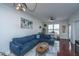 Spacious living room with sectional sofa, hardwood floors, and large window at 2244 Ashley Crossing Dr # 333, Charleston, SC 29414
