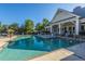 Inviting community pool with lounge chairs and clubhouse at 2244 Ashley Crossing Dr # 333, Charleston, SC 29414