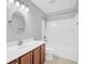 Modern bathroom with a tub shower combo and wood vanity at 226 Comiskey Park Cir, Summerville, SC 29485