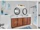 Double vanity bathroom with updated lighting and fixtures at 226 Comiskey Park Cir, Summerville, SC 29485