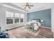 Main bedroom with ceiling fan and large windows at 226 Comiskey Park Cir, Summerville, SC 29485
