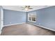 Spacious bedroom with light blue walls and hardwood floors at 226 Comiskey Park Cir, Summerville, SC 29485