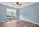 Serene bedroom with light blue walls and hardwood floors at 226 Comiskey Park Cir, Summerville, SC 29485