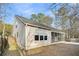 Tan house exterior with screened porch and fenced yard at 226 Comiskey Park Cir, Summerville, SC 29485
