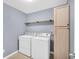 Laundry room with washer, dryer, shelving and cabinetry at 226 Comiskey Park Cir, Summerville, SC 29485