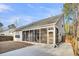 Home features a large screened porch, perfect for relaxing outdoors at 226 Comiskey Park Cir, Summerville, SC 29485