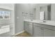 Bathroom showcasing a double vanity with modern fixtures and mirrors at 229 Grand View Xing, Summerville, SC 29483