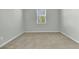 Neutral bedroom with a window, gray walls, and light carpet flooring at 229 Grand View Xing, Summerville, SC 29483
