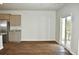 Bright, empty living room featuring wood floors and sliding glass doors to let in the light at 229 Grand View Xing, Summerville, SC 29483