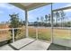 Screened porch view showcasing the backyard and surrounding pond at 229 Grand View Xing, Summerville, SC 29483