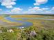 Aerial view of the property highlighting its waterfront location at 26 Cormorant Island Ln, Kiawah Island, SC 29455