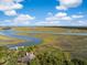 Expansive aerial view showcasing waterfront property and marshlands at 26 Cormorant Island Ln, Kiawah Island, SC 29455