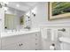 Elegant bathroom with white vanity, and a large mirror at 26 Cormorant Island Ln, Kiawah Island, SC 29455