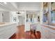 Spa-like bathroom with vanity, chandelier, and hardwood floors at 26 Cormorant Island Ln, Kiawah Island, SC 29455