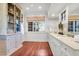 Bright bathroom with double vanity and hardwood floors at 26 Cormorant Island Ln, Kiawah Island, SC 29455