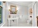 Clean bathroom with pedestal sink, toilet, and tiled floor at 26 Cormorant Island Ln, Kiawah Island, SC 29455