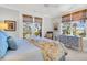 Bedroom with a king-size bed, access to balcony, and water views at 26 Cormorant Island Ln, Kiawah Island, SC 29455