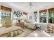 Twin bedroom with two beds, plenty of natural light, and unique wall decor at 26 Cormorant Island Ln, Kiawah Island, SC 29455