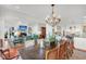 Open dining room with a large table and access to living and kitchen areas at 26 Cormorant Island Ln, Kiawah Island, SC 29455
