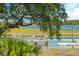 Private wooden dock extending over calm waters at 26 Cormorant Island Ln, Kiawah Island, SC 29455