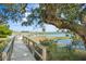 Wooden walkway leads to a private dock with water access at 26 Cormorant Island Ln, Kiawah Island, SC 29455