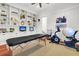 Home gym with exercise bike, massage table and built-in shelves at 26 Cormorant Island Ln, Kiawah Island, SC 29455