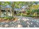 Home with two-car garage and lush landscaping at 26 Cormorant Island Ln, Kiawah Island, SC 29455