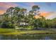 Picturesque home nestled amongst lush greenery near the water at 26 Cormorant Island Ln, Kiawah Island, SC 29455