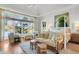 Spacious main bedroom with hardwood floors, sitting area, and large windows at 26 Cormorant Island Ln, Kiawah Island, SC 29455