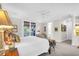 Bright main bedroom with king-size bed and private access at 26 Cormorant Island Ln, Kiawah Island, SC 29455