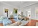 Bright main bedroom with hardwood floors, sitting area, and large windows at 26 Cormorant Island Ln, Kiawah Island, SC 29455