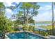 Inviting pool with waterfront views; expansive deck and lush landscaping at 26 Cormorant Island Ln, Kiawah Island, SC 29455